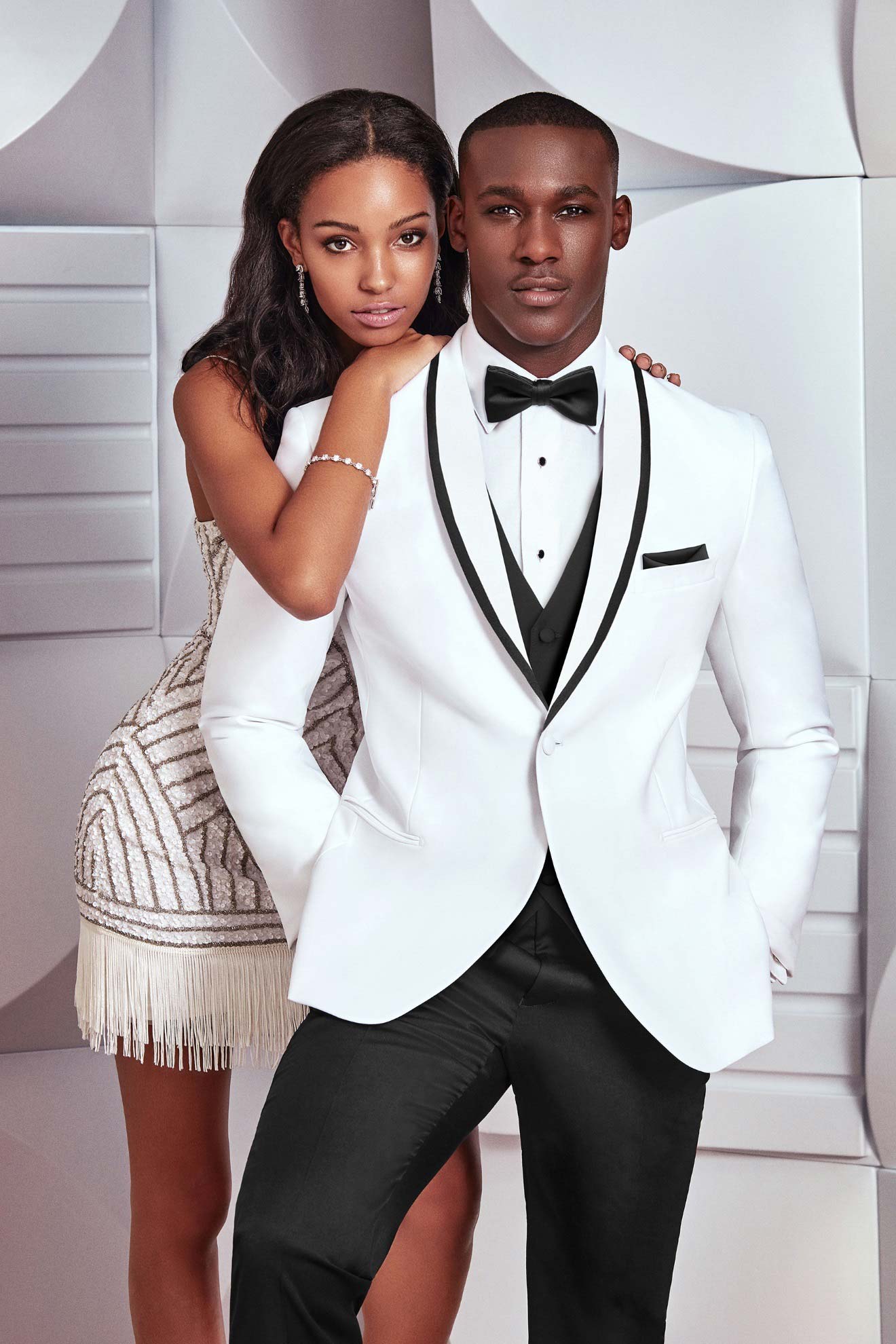 A man and woman posing in an Allure Charcoal rental.