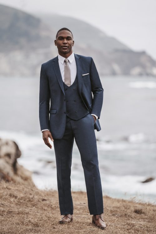 Stand out in the Allure Slate Blue Slim Fit Suit. Sleek, modern, and perfect for weddings or events. Book your fitting today!